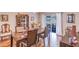 Dining room view showcasing hardwood floors, furnishings, and a glimpse of the backyard at 2031 Wekiva Reserve Blvd, Apopka, FL 32703