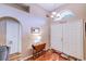 Warm entryway featuring wood floors, double doors, and a decorative transom window at 2031 Wekiva Reserve Blvd, Apopka, FL 32703