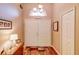 Bright foyer boasts a double-door entry, hardwood flooring, and ample natural light from a transom window at 2031 Wekiva Reserve Blvd, Apopka, FL 32703