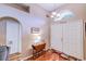 Inviting foyer with hardwood floors, a transom window, and a charming foyer table at 2031 Wekiva Reserve Blvd, Apopka, FL 32703