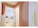 Hallway showing views into a bedroom and bathroom at 2031 Wekiva Reserve Blvd, Apopka, FL 32703