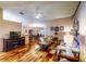 Spacious living room featuring hardwood floors, a ceiling fan, and ample seating at 2031 Wekiva Reserve Blvd, Apopka, FL 32703