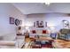 Comfortable living room with neutral tones, wood floors, and vaulted ceiling at 2031 Wekiva Reserve Blvd, Apopka, FL 32703