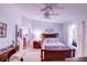 Charming bedroom has light walls and plenty of natural light through a nice window at 2031 Wekiva Reserve Blvd, Apopka, FL 32703