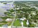 Aerial view of New Smyrna Beach neighborhood with nearby parks and a boat ramp at 216 N Riverside Dr, Edgewater, FL 32132