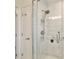 Modern glass shower with upgraded shower head and built in shower caddy at 216 N Riverside Dr, Edgewater, FL 32132