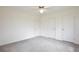 Bedroom with three doors and neutral carpeting at 216 N Riverside Dr, Edgewater, FL 32132