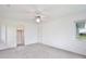 Bedroom featuring an open closet and a window with outdoor views at 216 N Riverside Dr, Edgewater, FL 32132