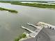 Aerial view of a public boat ramp showing the docks, boat launch, parking area, and surrounding waterway at 216 N Riverside Dr, Edgewater, FL 32132