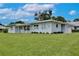 Lovely single-story home with a lush green lawn, offering a serene and inviting curb appeal at 216 N Riverside Dr, Edgewater, FL 32132