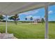 Inviting front porch view, showcasing the lush green lawn and neighborhood charm at 216 N Riverside Dr, Edgewater, FL 32132