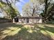 Large backyard showcasing the home's exterior and lawn at 2342 Alice Ave, Eustis, FL 32726