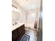 Bathroom with a shower and tub combination, modern vanity, and neutral tones for a relaxing experience at 2342 Alice Ave, Eustis, FL 32726