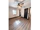 Light-filled bedroom featuring neutral walls and modern dark trim at 2342 Alice Ave, Eustis, FL 32726