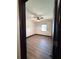 Bright bedroom with a ceiling fan and wood floors at 2342 Alice Ave, Eustis, FL 32726