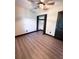 Spacious bedroom featuring modern ceiling fan, wood-look flooring, and a closet for optimal storage at 2342 Alice Ave, Eustis, FL 32726
