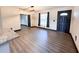 Bright dining room with hardwood floors, a modern light fixture, and access to other rooms at 2342 Alice Ave, Eustis, FL 32726
