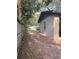 Side view of the house, featuring a freshly painted exterior, privacy fence, and gated access to the backyard at 2342 Alice Ave, Eustis, FL 32726