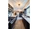 Galley kitchen featuring stainless steel appliances, granite countertops, and custom cabinetry at 2342 Alice Ave, Eustis, FL 32726