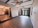 Bright living room featuring ceiling fans, wood floors, and access to the backyard at 2342 Alice Ave, Eustis, FL 32726
