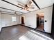 Bright living room featuring ceiling fans, wood floors, and ample natural light at 2342 Alice Ave, Eustis, FL 32726