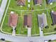 Bird's eye view of the house, driveway and surrounding homes in the neighborhood at 2713 Eagle Glen Cir, Kissimmee, FL 34746