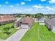 Overhead view of a single-story home in a residential neighborhood with manicured lawns at 2713 Eagle Glen Cir, Kissimmee, FL 34746
