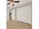 Bedroom boasts tile floors, closet, and entry door to kitchen at 2713 Eagle Glen Cir, Kissimmee, FL 34746