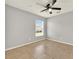 Bedroom with tile floors, ceiling fan, and large window at 2713 Eagle Glen Cir, Kissimmee, FL 34746