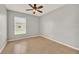 Bedroom boasts natural light, ceiling fan and tile floors at 2713 Eagle Glen Cir, Kissimmee, FL 34746