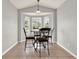 Bright breakfast nook features tile floors and a bay window with backyard views at 2713 Eagle Glen Cir, Kissimmee, FL 34746