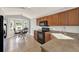 Well-lit kitchen features wood cabinets, black appliances, and breakfast nook at 2713 Eagle Glen Cir, Kissimmee, FL 34746