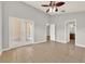 Spacious living room with ceiling fan, tile floors, and access to patio at 2713 Eagle Glen Cir, Kissimmee, FL 34746