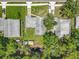 An aerial view showing the property's layout, backyard sheds, and surrounding trees at 2728 Hertha Ave, Orlando, FL 32826