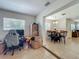 Bonus room is currently filled with items but has tile floors, and access to other rooms at 2728 Hertha Ave, Orlando, FL 32826