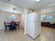 Cozy dining area adjacent to the kitchen features a table and chairs for Gathering meals at 2728 Hertha Ave, Orlando, FL 32826