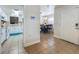 Hallway view of the kitchen and dining room areas of the home at 2728 Hertha Ave, Orlando, FL 32826