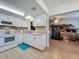 Bright kitchen features white cabinets, modern appliances, and neutral countertops at 2728 Hertha Ave, Orlando, FL 32826