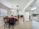 Connected dining and living areas provide an open layout, tiled floors, and lots of space at 2728 Hertha Ave, Orlando, FL 32826