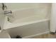 Brightly lit bathtub and shower combination at 2824 Neverland Dr, New Smyrna Beach, FL 32168