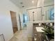 Elegant bathroom with granite countertops, tiled floors, and a glass-enclosed shower at 2824 Neverland Dr, New Smyrna Beach, FL 32168