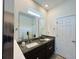 Elegant bathroom featuring double sinks, granite countertops, and modern fixtures at 2824 Neverland Dr, New Smyrna Beach, FL 32168