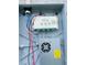Trimlight control box with various electrical components and wiring, ensuring efficient outdoor lighting at 2824 Neverland Dr, New Smyrna Beach, FL 32168