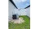 Exterior view with side yard and HVAC at 2824 Neverland Dr, New Smyrna Beach, FL 32168
