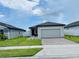 Cozy single-story house with manicured lawn, brick driveway, and close to neighbors at 2824 Neverland Dr, New Smyrna Beach, FL 32168