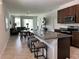 Spacious kitchen with a granite island, stainless steel appliances, and an open floor plan at 2824 Neverland Dr, New Smyrna Beach, FL 32168