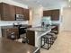 Modern kitchen with stainless steel appliances, granite counters, and a large island at 2824 Neverland Dr, New Smyrna Beach, FL 32168