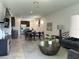Bright, open-concept living space with modern furnishings and neutral tones at 2824 Neverland Dr, New Smyrna Beach, FL 32168