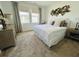 This bedroom has carpet flooring, two windows with curtains, a dresser and light paint at 2824 Neverland Dr, New Smyrna Beach, FL 32168
