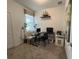 Bright room featuring neutral walls, carpet flooring, natural light, a desk, and seating creating a functional workspace at 2824 Neverland Dr, New Smyrna Beach, FL 32168